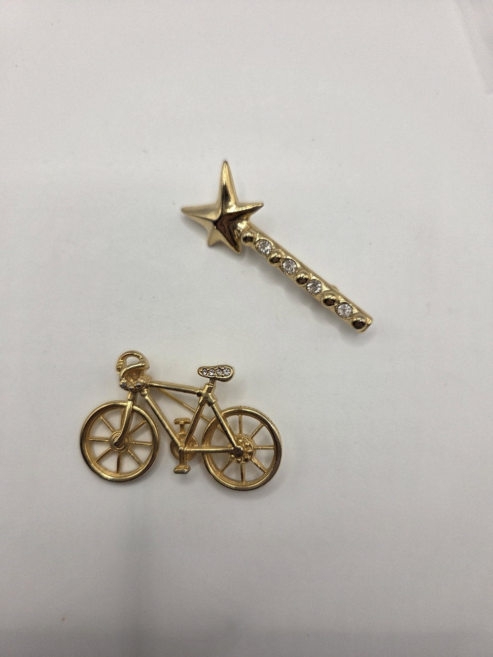 1569. Set Of Two Fun Gold Tone Brooches